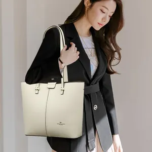Chic cream leather tote bag with lychee texture and shoulder straps for daily use