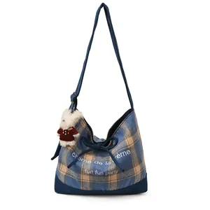 Plaid canvas tote bag with adjustable strap and cute bear charm in blue and yellow