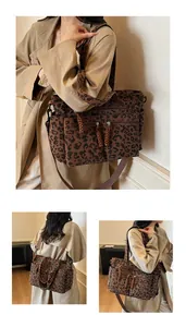 Detail of leopard print tote bag showing corduroy texture and multi-pocket design