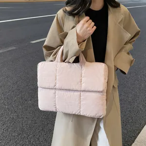 Quilted light pink puffer tote bag with square stitching for women in street style