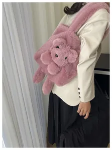 Model wearing a pink plush shoulder bag with a cute 3D teddy bear design and soft faux fur