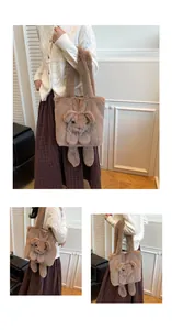 Detailed view of plush tote bag with brown faux rabbit fur and cute teddy bear ornament