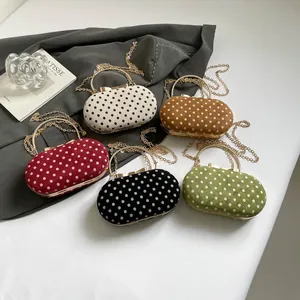 Suede polka dot clutch bags with gold metal handles and chain straps in five colors