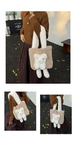 Detail of plush khaki tote bag featuring a cute white 3D bear and soft faux fur texture