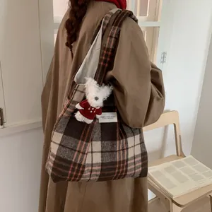 Classic plaid woolen tote bag in brown and beige with a cute plush dog pendant