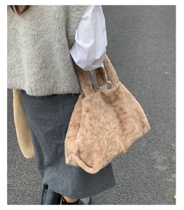 Detail of soft beige faux fur tote bag showing high-density plush texture and fluffy design