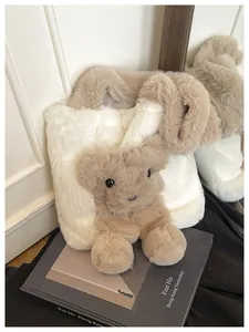 Detailed view of a soft faux fur tote bag featuring a cute 3D plush bear ornament