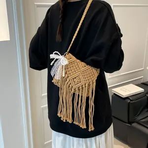 Handmade macrame woven crossbody bag with long fringes and pearl lace bow charm