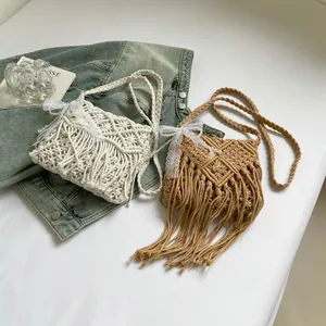 Handmade bohemian cotton rope crossbody bag with tassels and pearl lace details