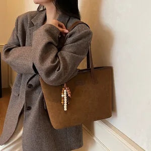 Vintage brown frosted faux suede tote bag with leopard print accent and beaded tassel