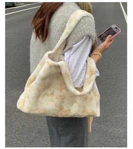 Model wearing a large plush marble-pattern tote bag in a casual outdoor street setting