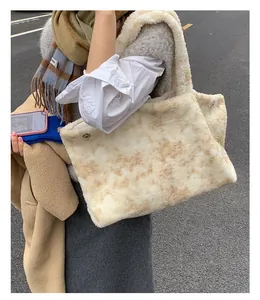 Close-up of plush tote bag showing soft faux fur texture and side metal buckle