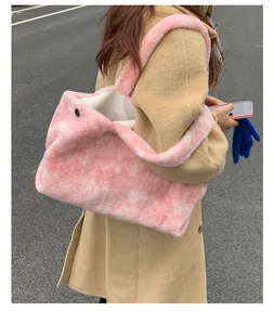 Detail of pink tie-dye faux fur tote bag showing the magnetic snap and fluffy texture