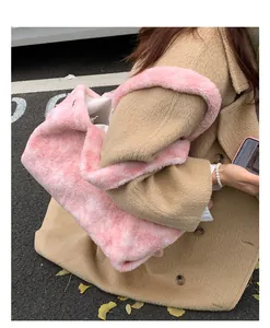 Detail of pink faux fur tote bag showing the soft plush texture and wide shoulder strap
