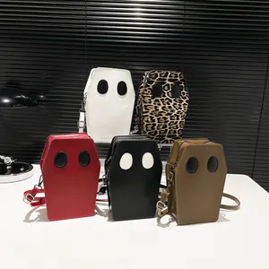 Ghost coffin-shaped crossbody bags set in various colors including leopard and red