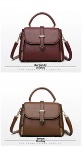 Detail of burgundy and brown crossbody bags with litchi texture and gold heart buckles