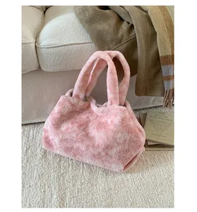 Close-up of pink faux fur tote bag with plush texture and stylish tie-dye pattern detail