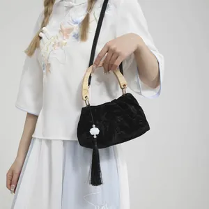 New Chinese style black velvet handbag with wooden handle and long pearl tassel