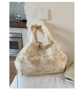 Detailed close-up of fluffy faux fur tote bag with beige tie-dye pattern on soft fabric