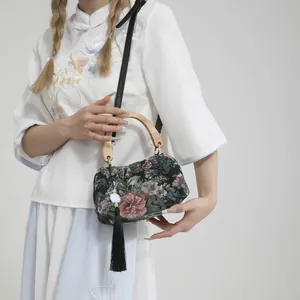 Elegant Chinese style black velvet handbag with floral embroidery and wooden handles