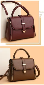 Detail view of burgundy and brown crossbody bags with pebble texture and cat hardware