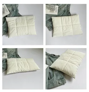 Quilted off-white down padded pouch with rectangle embossed stitching and puffy texture