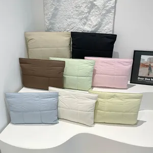 Minimalist quilted puffer laptop sleeve in multiple soft colors with magnetic closure