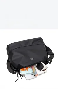 Internal view of nylon crossbody bag showing spacious storage for phone and accessories
