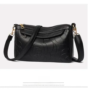 Détail en cuir PU noir avec motif rose gaufré et fermetures éclair dorées pour sac à main