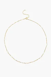 Detail of 18k gold plated titanium chain with natural freshwater pearls and clasp