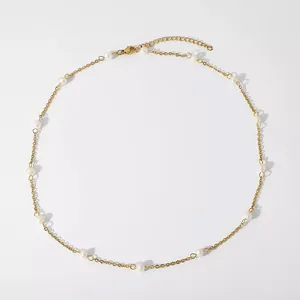 Detail of 18k gold plated titanium necklace featuring natural freshwater pearls and clasp