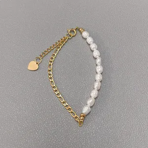Detail of 18k gold plated chain with baroque freshwater pearls and heart charm