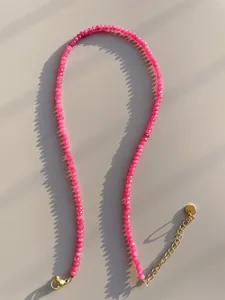 Close-up of rose red natural stone beads with adjustable 18k gold plated clasp