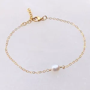 Detail of 18k gold plated stainless steel chain necklace with a natural freshwater pearl