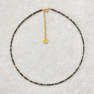 Vintage faceted natural stone beaded necklace with a gold heart pendant and lobster clasp