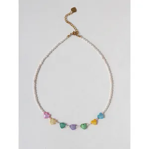 Handmade freshwater pearl necklace with rainbow heart charms and adjustable gold clasp