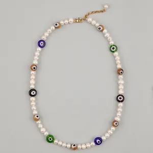 Minimalist freshwater pearl necklace with colorful evil eye beads and gold clasp detail