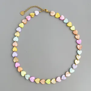 Detailed view of heart-shaped shell beads on a 18k gold plated stainless steel chain
