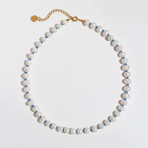 French vintage necklace with natural freshwater pearls and blue beads in a circular layout