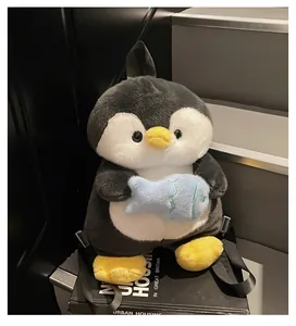 Detail of cute plush penguin backpack featuring soft fur texture and small blue fish accessory