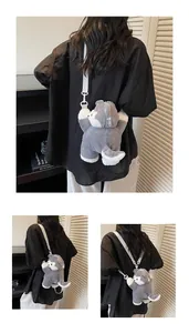 Detail view of plush husky dog backpack with zipper closure and adjustable white strap
