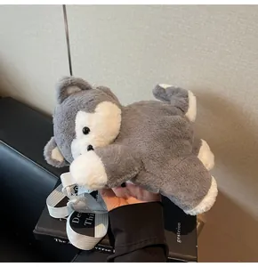 Close-up of cute husky plush backpack featuring soft grey and white faux fur texture