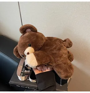 Brown fluffy bear plush bag with adjustable cream strap and metal buckle hardware