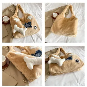 Detail view of khaki faux fur tote bag with star denim patches and 3D bone ornament