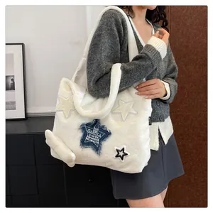 Detail of white plush tote bag featuring denim star patch and fuzzy lamb wool texture