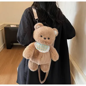 Detailed view of a plush brown bear crossbody bag with adjustable strap on a model