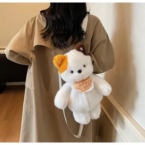 Detail of white plush bear backpack with asymmetrical colorful ears and checkered bib