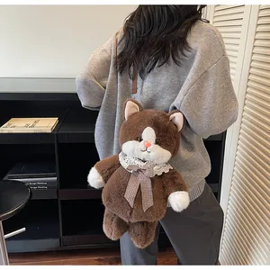 Detail of plush cat crossbody bag featuring brown fur, white lace and checkered bow