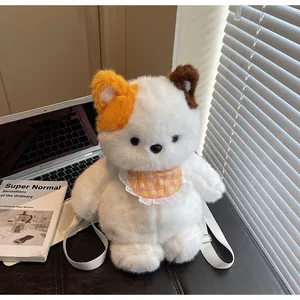 Detail of white plush bear backpack featuring fluffy long hair texture and lace bib