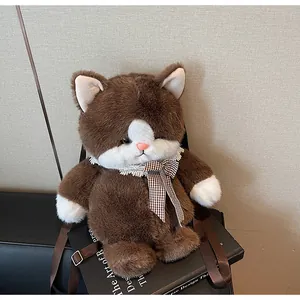 Detail of plush cat backpack with lace collar, checkered bow, and brown nylon straps